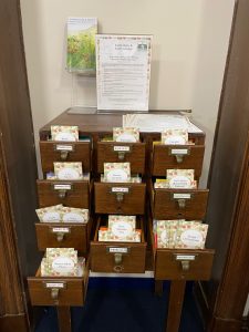 for screen readers: Grafton's seed library is housed in an antique card catalog